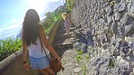 Two friends and tourists exploring a foreign city during a hike outside