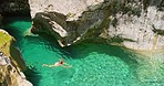Woman in white bikini swimming in a lake on holiday from above. Woman on holiday swimming in a lake from above